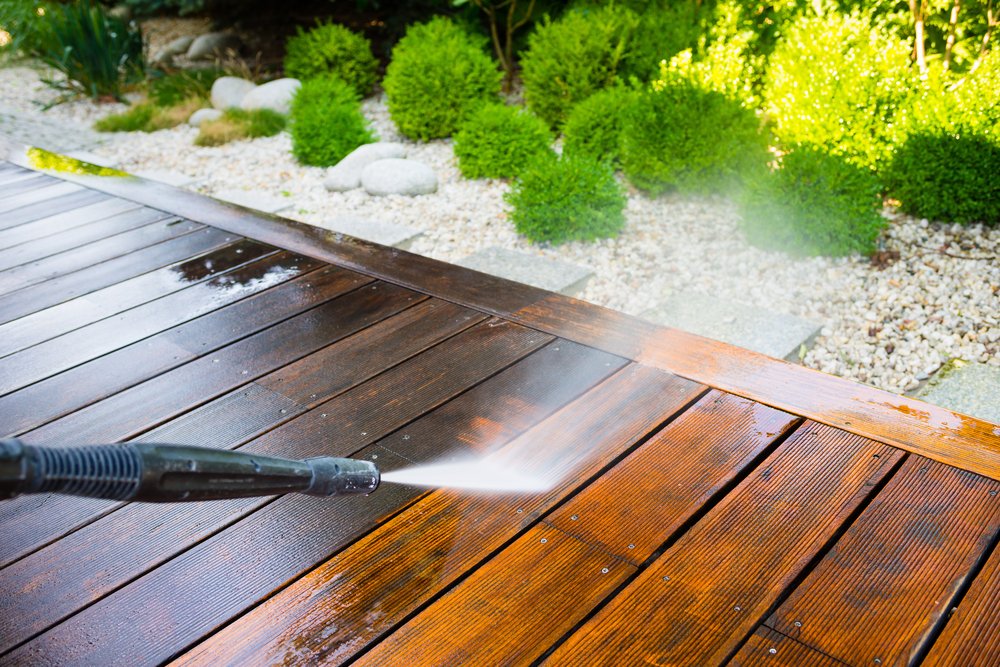Wooden Deck Getting Pressure Washed to Look Like New