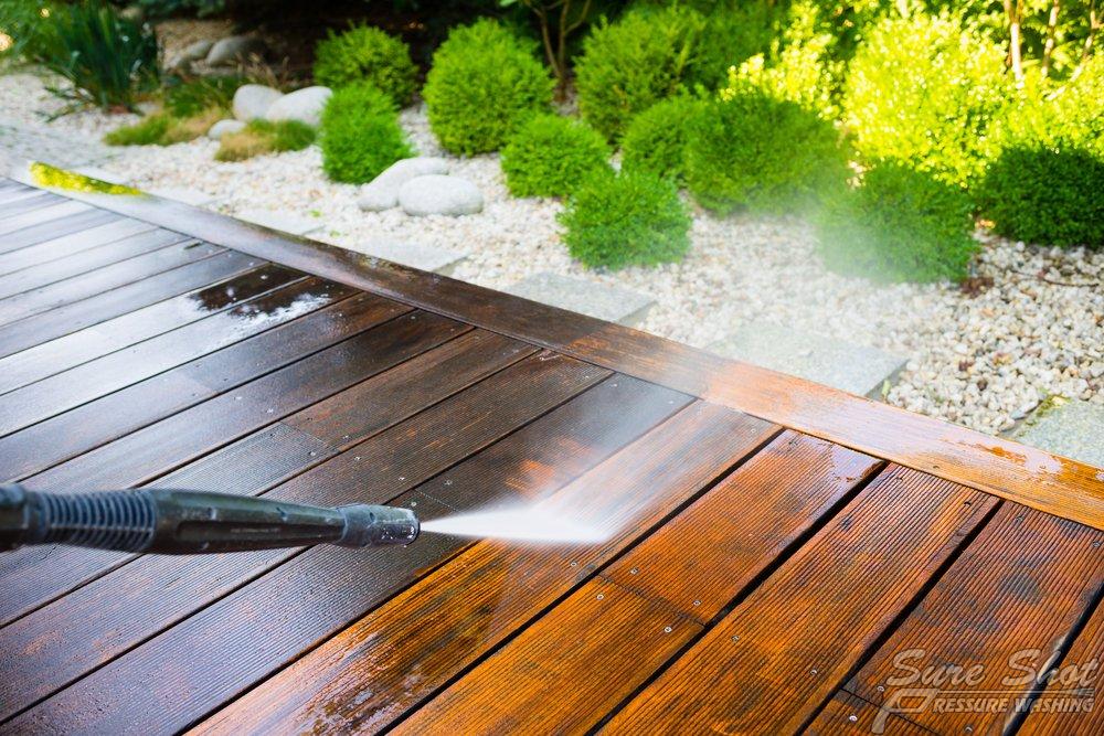 Areas of Home Pressure Washing Wooden Deck Getting Pressure Washed to Look Like New